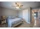 A cozy bedroom with decoratively coordinated lamps and throw pillows plus an adjacent hallway entrance at 9390 Little Gasparilla Island, Placida, FL 33946