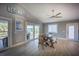 Bright dining area with a table and bench seating, offering access to outdoor decks and natural light at 9390 Little Gasparilla Island, Placida, FL 33946