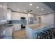 Spacious kitchen featuring granite countertops, stainless steel appliances, and a center island with bar stool seating at 9390 Little Gasparilla Island, Placida, FL 33946