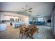 Open living space featuring a modern kitchen, dining area, and cozy living room with stylish furniture at 9390 Little Gasparilla Island, Placida, FL 33946
