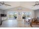 Spacious living area with a dining area and access to outdoor decks through sliding glass doors at 9390 Little Gasparilla Island, Placida, FL 33946