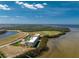 Aerial view of waterfront condo complex with pool and tennis courts at 101 N Marion Ct # 215, Punta Gorda, FL 33950
