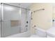Bathroom featuring a walk-in shower with a glass door, chrome fixtures, and bright white tiles at 101 N Marion Ct # 215, Punta Gorda, FL 33950