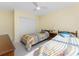 Well-lit bedroom with twin beds, a side table with lamp, and a closet with sliding doors at 101 N Marion Ct # 215, Punta Gorda, FL 33950