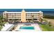 Stylish condo building featuring a swimming pool and covered parking at 101 N Marion Ct # 215, Punta Gorda, FL 33950