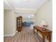 Hallway leading to the living area with wood floors and neutral paint at 101 N Marion Ct # 215, Punta Gorda, FL 33950