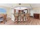 Bright kitchen features wood floors, bar seating and stainless steel appliances at 101 N Marion Ct # 215, Punta Gorda, FL 33950