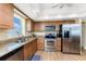Updated kitchen with stainless steel appliances, granite counters and wood floors at 101 N Marion Ct # 215, Punta Gorda, FL 33950