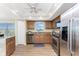 Updated kitchen with stainless steel appliances, granite counters and wood floors at 101 N Marion Ct # 215, Punta Gorda, FL 33950