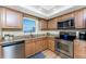 Updated kitchen with stainless steel appliances, granite counters and wood floors at 101 N Marion Ct # 215, Punta Gorda, FL 33950