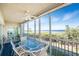 Screened lanai with seating offers stunning views of the bay and mangroves at 101 N Marion Ct # 215, Punta Gorda, FL 33950