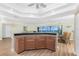 Open floor plan featuring an updated kitchen with bar and a dining area with ocean views at 101 N Marion Ct # 215, Punta Gorda, FL 33950