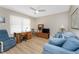Cozy living room featuring a desk, bookcase, comfortable seating and natural light at 101 N Marion Ct # 215, Punta Gorda, FL 33950