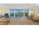 Bright living area with hardwood floors, balcony overlooking water, and comfortable furniture at 101 N Marion Ct # 215, Punta Gorda, FL 33950
