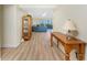 Inviting living room with hardwood floors, cabinet, and sliding doors to balcony at 101 N Marion Ct # 215, Punta Gorda, FL 33950