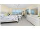 Bright main bedroom with balcony access offering beautiful views of the ocean and updated furnishings at 101 N Marion Ct # 215, Punta Gorda, FL 33950