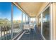 Inviting screened-in patio with tiled floor and beautiful ocean views, perfect for outdoor dining and relaxation at 101 N Marion Ct # 215, Punta Gorda, FL 33950