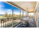 Inviting screened-in patio with tiled floor and beautiful ocean views, perfect for outdoor dining and relaxation at 101 N Marion Ct # 215, Punta Gorda, FL 33950