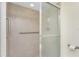 Bathroom featuring a glass shower with tile surround, grab bar and accessible shower controls at 101 N Marion Ct # 215, Punta Gorda, FL 33950