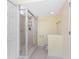 Bathroom featuring a glass shower, tiled flooring, a toilet and a towel rack at 101 N Marion Ct # 215, Punta Gorda, FL 33950