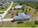 A lovely home sits among lush trees and manicured lawns at 1025 Boundary Blvd, Rotonda West, FL 33947