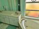 Bright bathroom featuring double vanity, bathtub, and a window providing natural light at 1025 Boundary Blvd, Rotonda West, FL 33947