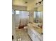 Cozy bathroom featuring a shower-tub combo and a single sink vanity at 1025 Boundary Blvd, Rotonda West, FL 33947