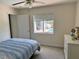 Bright bedroom featuring a window view of the pool at 1025 Boundary Blvd, Rotonda West, FL 33947