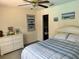 Cozy bedroom featuring a bed, dresser, and closet at 1025 Boundary Blvd, Rotonda West, FL 33947