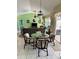 Inviting dining area offering comfortable seating, stylish décor, and seamless transitions between the dining and living spaces at 1025 Boundary Blvd, Rotonda West, FL 33947