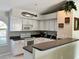 Well-lit kitchen featuring white cabinetry, modern appliances, and a convenient breakfast bar area at 1025 Boundary Blvd, Rotonda West, FL 33947