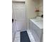 Laundry room with washer, dryer, and ample storage space at 1025 Boundary Blvd, Rotonda West, FL 33947