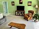 A comfortable living room featuring a leather armchair, light green walls and ample seating at 1025 Boundary Blvd, Rotonda West, FL 33947