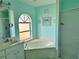 Main bathroom featuring a soaking tub, walk-in shower, and modern fixtures at 1025 Boundary Blvd, Rotonda West, FL 33947
