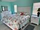 Beautiful main bedroom with coastal-themed bedding and coordinated white furnishings at 1025 Boundary Blvd, Rotonda West, FL 33947