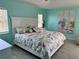 Relaxing main bedroom with wood-look floors, and a coastal-themed decor at 1025 Boundary Blvd, Rotonda West, FL 33947