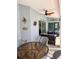 Relaxing covered patio with ceiling fan, decorative wall art, and comfortable seating, perfect for outdoor enjoyment at 1025 Boundary Blvd, Rotonda West, FL 33947
