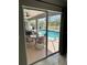 View of screened-in patio and pool with outdoor seating at 1025 Boundary Blvd, Rotonda West, FL 33947