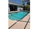 Inviting screened-in pool with ample space for relaxation and a clear view of the adjacent patio and backyard at 1025 Boundary Blvd, Rotonda West, FL 33947