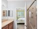 Bathroom offering vanity space and an open doorway that looks into bedroom at 1215 Jonah Dr, North Port, FL 34289