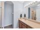 Bathroom featuring a vanity with a large mirror, modern light fixture and walk-in shower at 1215 Jonah Dr, North Port, FL 34289