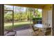 Screened lanai overlooking lush backyard landscaping and private views at 1215 Jonah Dr, North Port, FL 34289