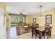 Cozy living room offering comfortable seating, natural light, and seamless access to the outdoor space at 1215 Jonah Dr, North Port, FL 34289