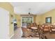 Comfortable living room featuring tile floors, ceiling fan, and sliding glass doors to the outside at 1215 Jonah Dr, North Port, FL 34289
