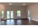 Open concept living room with wood-look flooring and natural light at 13236 Pace Cir, Port Charlotte, FL 33981