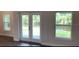 Bright living area featuring backyard views from adjacent windows and glass doors at 13236 Pace Cir, Port Charlotte, FL 33981