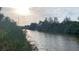 Picturesque water view of channel with mature trees at 13236 Pace Cir, Port Charlotte, FL 33981