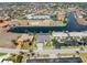 Aerial view of stunning neighborhood on canal, with meticulously maintained lawn and landscaping at 1330 Mineo Dr, Punta Gorda, FL 33950