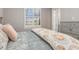 This is a well lit bedroom with a large window, white floors, and a gray color scheme at 1330 Mineo Dr, Punta Gorda, FL 33950
