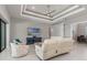 Inviting living room with tray ceiling, modern furniture, and a view of the outdoor scenery at 1330 Mineo Dr, Punta Gorda, FL 33950